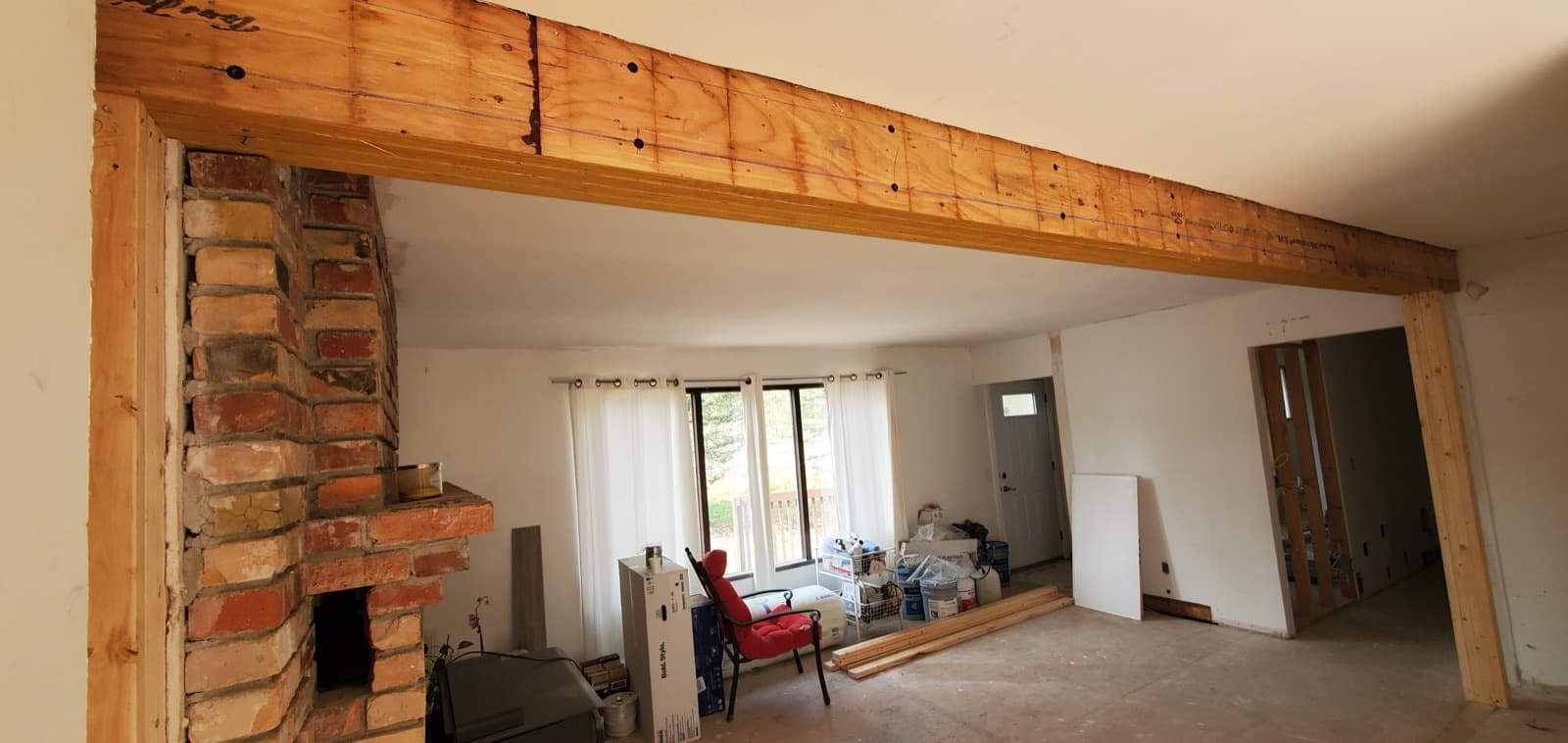 Open main floor after a load-bearing wall was removed and replaced with a beam